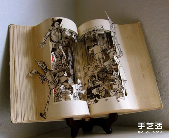 经典书籍上的雕塑作品 艺术般的立体纸雕图片 